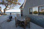 The deck with a dining area, chimnea, grill, and propane lobster cooker.
